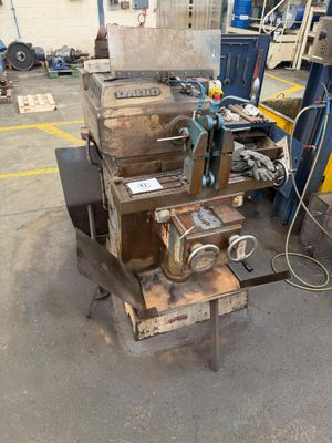 a machine that is sitting on a table in a warehouse