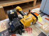a yellow and black machine sitting on top of a table