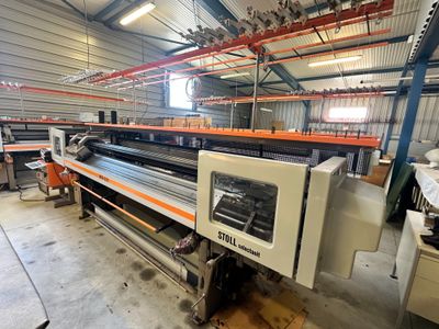 a machine that is working in a factory with a lot of machines