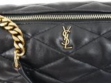 a close up of a black bag with a gold chain