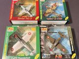 three boxed boxes of toy airplanes sitting on a table