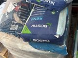 a pile of bags of cement on top of a pallet