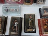 a lot of action figures on display on the table