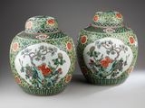 pair of chinese vases with flowers and birds on them
