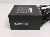 a black box with a power cord attached to it
