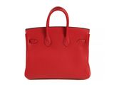 a red leather handbag on a white background