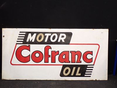 un panneau sur lequel est inscrit « huile Motor Cofrane »