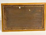 an old wooden picture frame sitting on top of a white surface