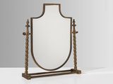 un grand miroir avec un cadre en métal et un socle en bois