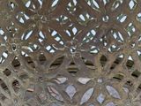 a close up of a metal bowl with a pattern on it