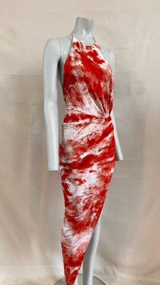 a red and white tie dye dress on a mannequin mannequin