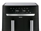 an image of a black and silver air fryer sitting on top of a counter
