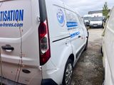 a white van that is parked in a lot