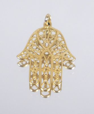 an image of a gold hamsa hand pendant with filigree filigree filigree fili