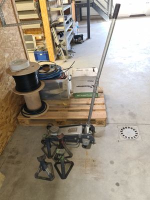 a picture of a garage with tools on a pallet