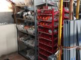 a lot of items that are on a cart in the warehouse