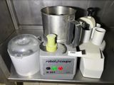 a blender and a blender sitting on a metal counter