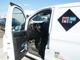 a white van with the door open in a parking lot