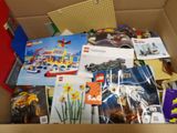 a box full of legos and other toys in it