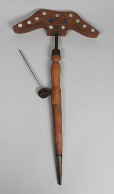 an old wooden hammer with a wooden handle on a white background