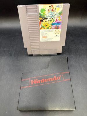 un gros plan sur un jeu Nintendo posé sur une table, à côté d'une boîte