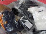 a pile of clothing in a plastic bag on a table