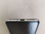a close up of the back of a cell phone on a table