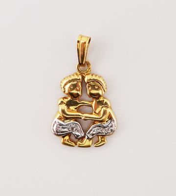 a gold and silver pendant with two hands holding each other