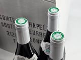 two bottles of wine that are sitting in a box