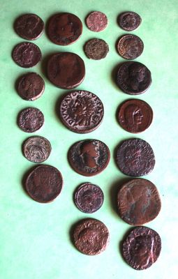 a lot of coins that are on a green surface