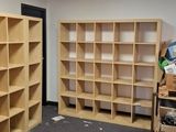 a room that has a bunch of shelves in it