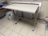 a white desk with a printer on it in a room