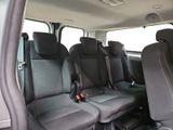 four seats in the back of a van that are empty