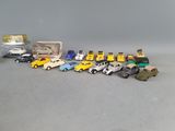 a lot of toy cars that are sitting on the table