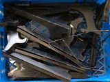 a blue crate filled with tools sitting on a table