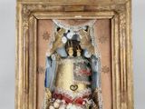 an image of a picture of a statue of a woman in a gold frame