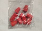 a bag of red plastic pieces on a table