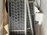 a computer keyboard and mouse sitting in a plastic bag