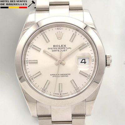 a rolex watch with a white dial on a bracelet