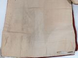 a piece of cloth that has been folded up on a table