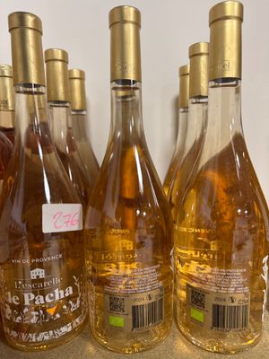 several bottles of wine are lined up on a counter