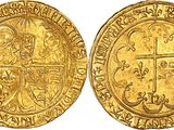 a gold coin with a cross on the front and a cross on the back