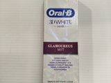 toothpaste in a box on a table with a toothbrush in it