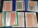 five binders with stamps on them on a table
