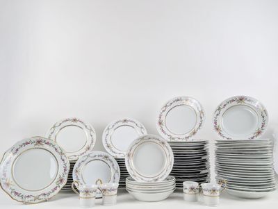 a lot of plates that are stacked together on the table