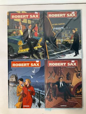 three books of robert sax and robert sax on a table