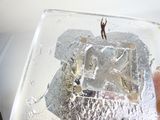 a person standing on top of a piece of ice