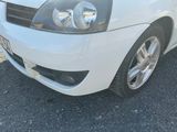 a picture of a white car parked in a parking lot