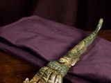 an image of a wooden table with a purple napkin and a wooden spoon
