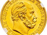 a close up of a gold coin with a man ' s face on it